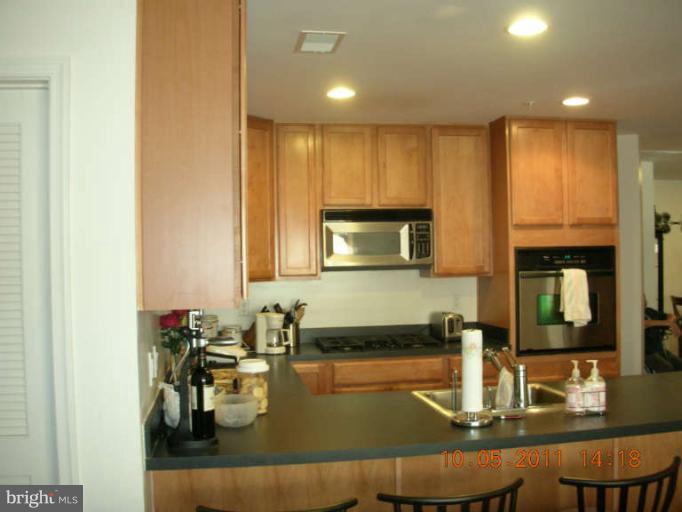 9510 Coyle Road, Unit 201 Owings Mills, MD 21117 - Photo 8 of 14 a kitchen with counter top space