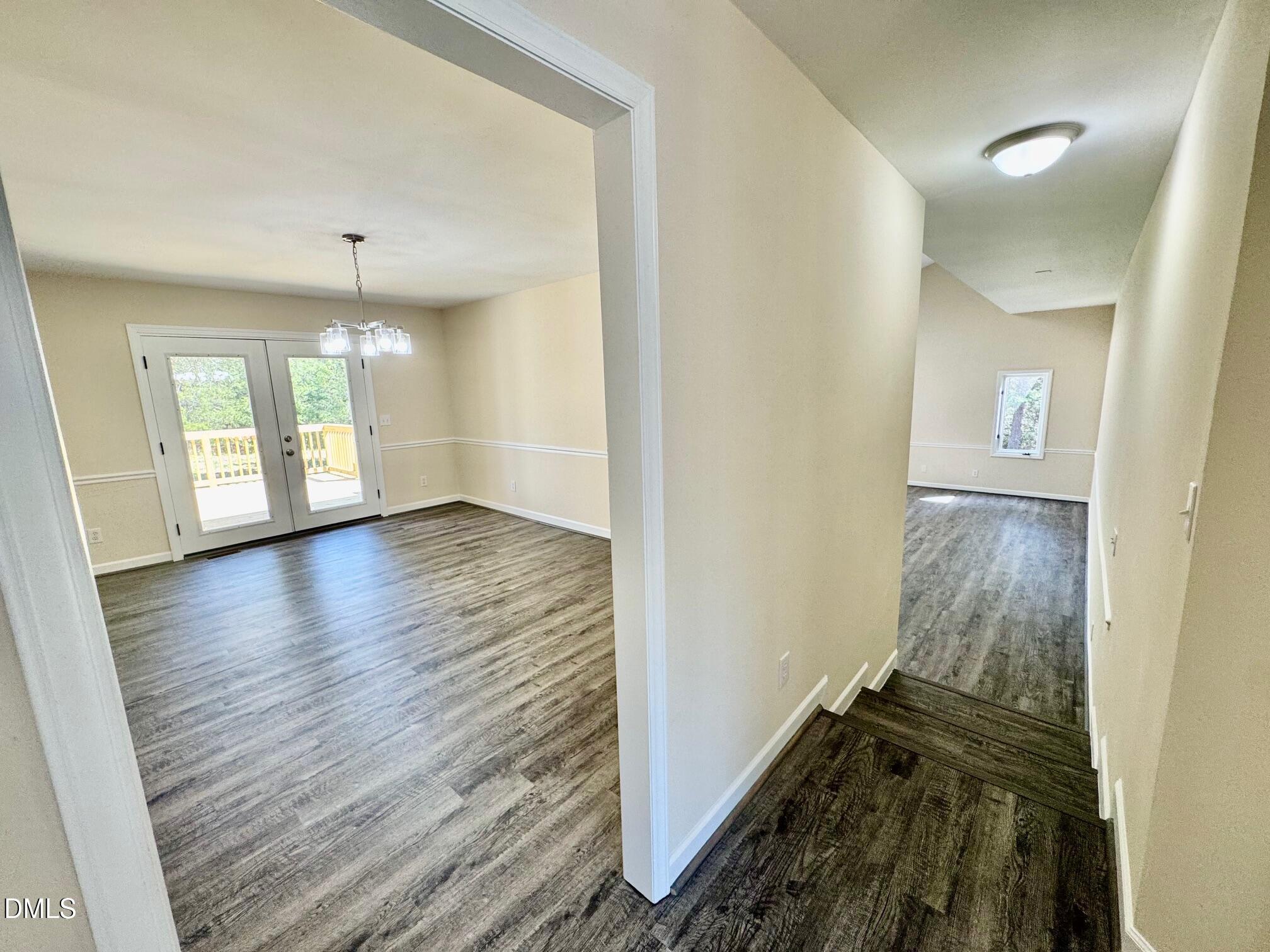 1720 Ross Mill Road Henderson, NC 27537 - Photo 14 of 42 wooden floor in an empty room with a window