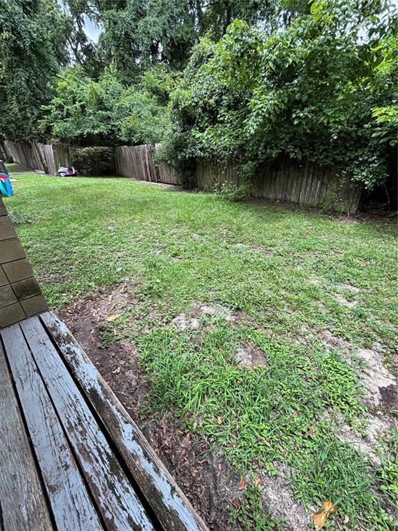 4224 Southwest 70th Terrace, Unit A Gainesville, FL 32608 - Photo 17 of 20 a view of a backyard with a lake view