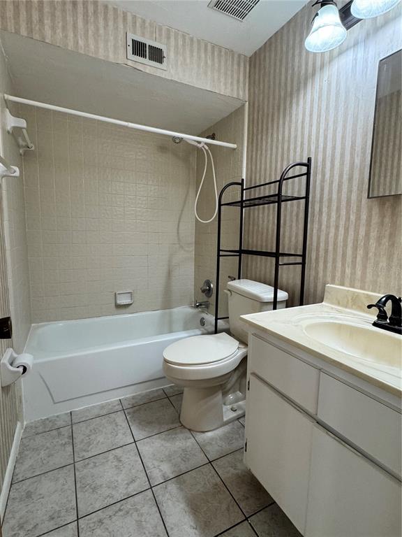 4224 Southwest 70th Terrace, Unit A Gainesville, FL 32608 - Photo 20 of 25 a bathroom with a sink a toilet and shower