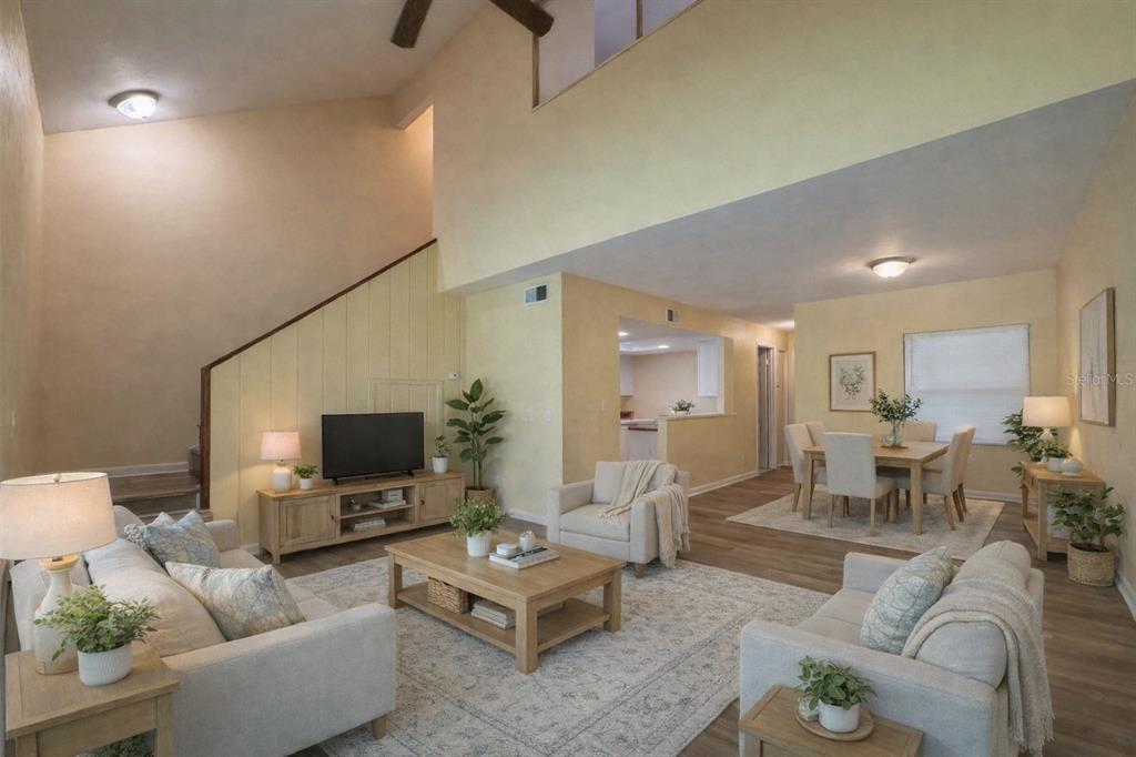 4224 Southwest 70th Terrace, Unit A Gainesville, FL 32608 - Photo 3 of 20 a living room with furniture and a flat screen tv