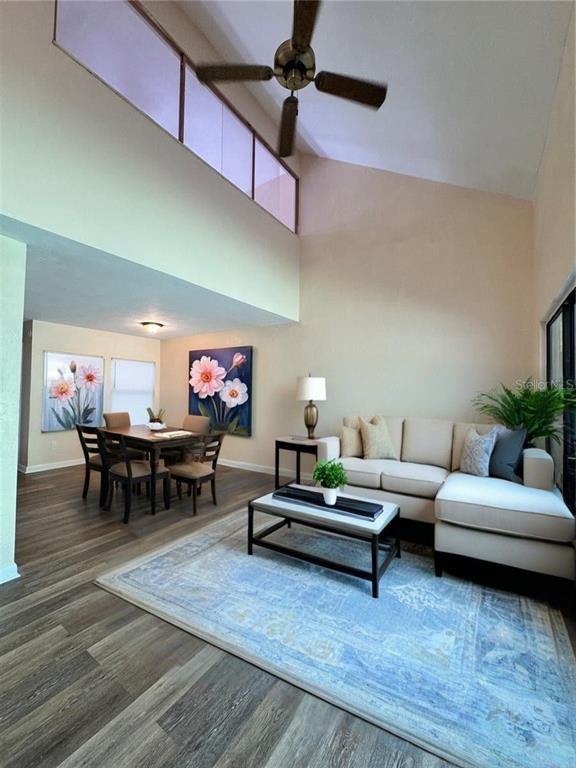 4224 Southwest 70th Terrace, Unit A Gainesville, FL 32608 - Photo 8 of 25 a living room with furniture and a flat screen tv