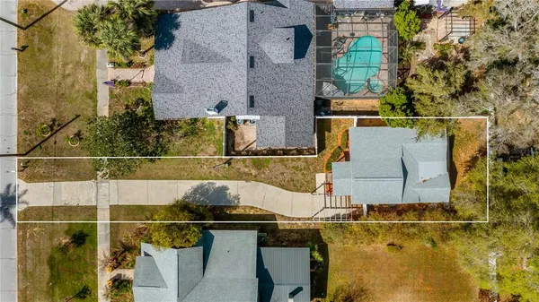 an aerial view of residential building with green space