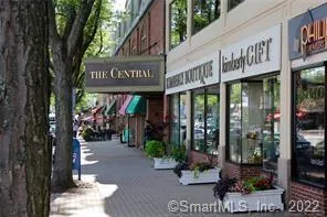 a view of street with sitting area