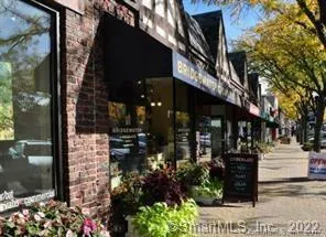 a view of path along with retail shop and buildings