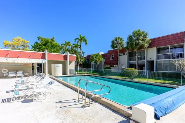 a view of a swimming pool with a patio