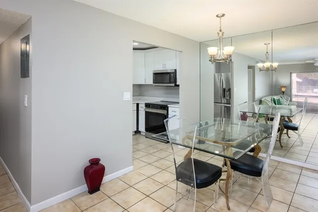 a bathroom with a sink a toilet a mirror and shower