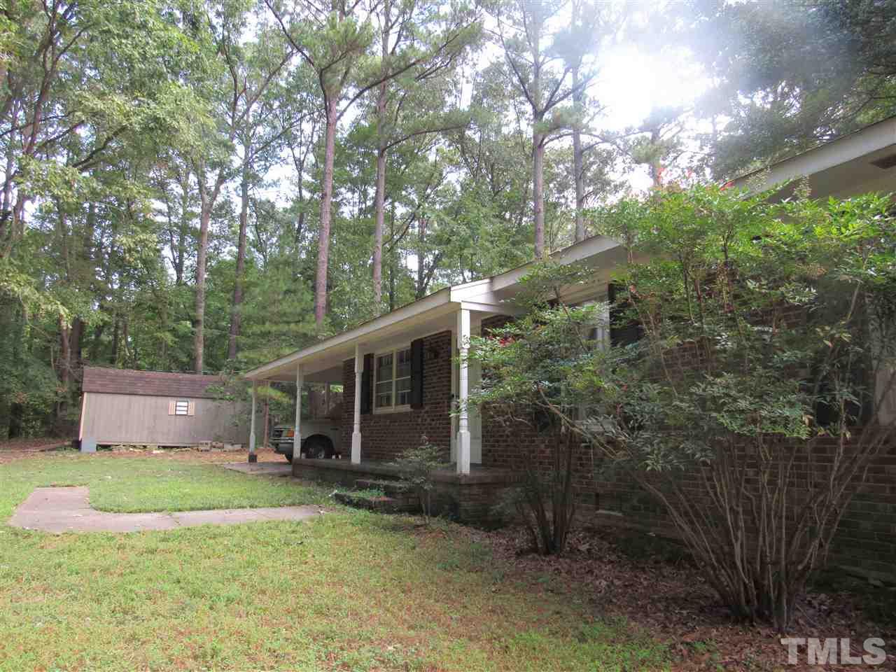 13624 New Light Road Raleigh, NC 27614 - Photo 1 of 12 a view of a house with backyard and tree