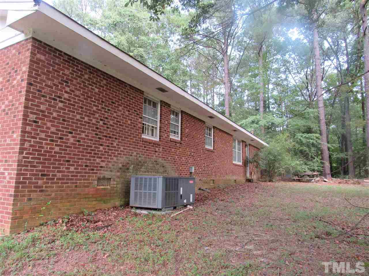 13624 New Light Road Raleigh, NC 27614 - Photo 12 of 12 a backyard of a house with lots of green space