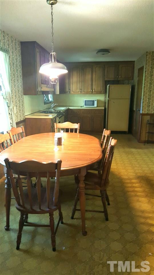13624 New Light Road Raleigh, NC 27614 - Photo 4 of 12 a dining room with furniture and window