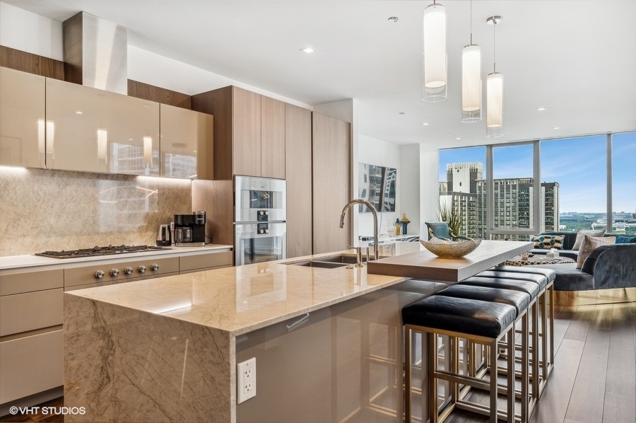 363 East Wacker Drive, Unit 2103 Chicago, IL 60601 - Photo 7 of 19 a kitchen with a stove a sink and a refrigerator