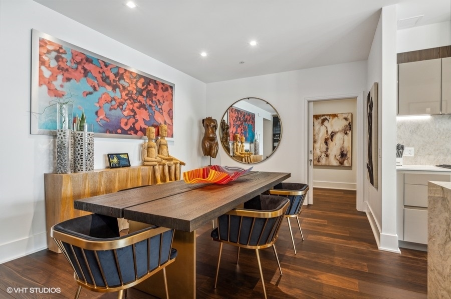 363 East Wacker Drive, Unit 2103 Chicago, IL 60601 - Photo 10 of 19 a view of a dining room with furniture and wooden floor