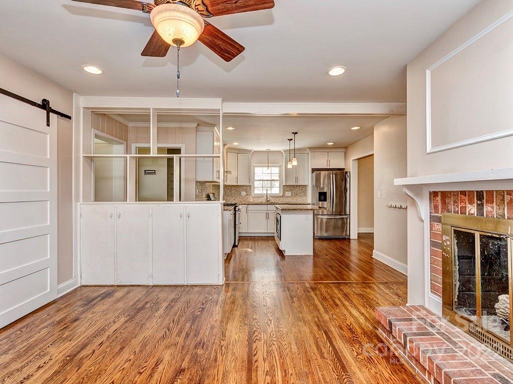 259 North Sharon Amity Road Charlotte, NC 28211 - Photo 13 of 27 a view of kitchen and dining room with wooden floor