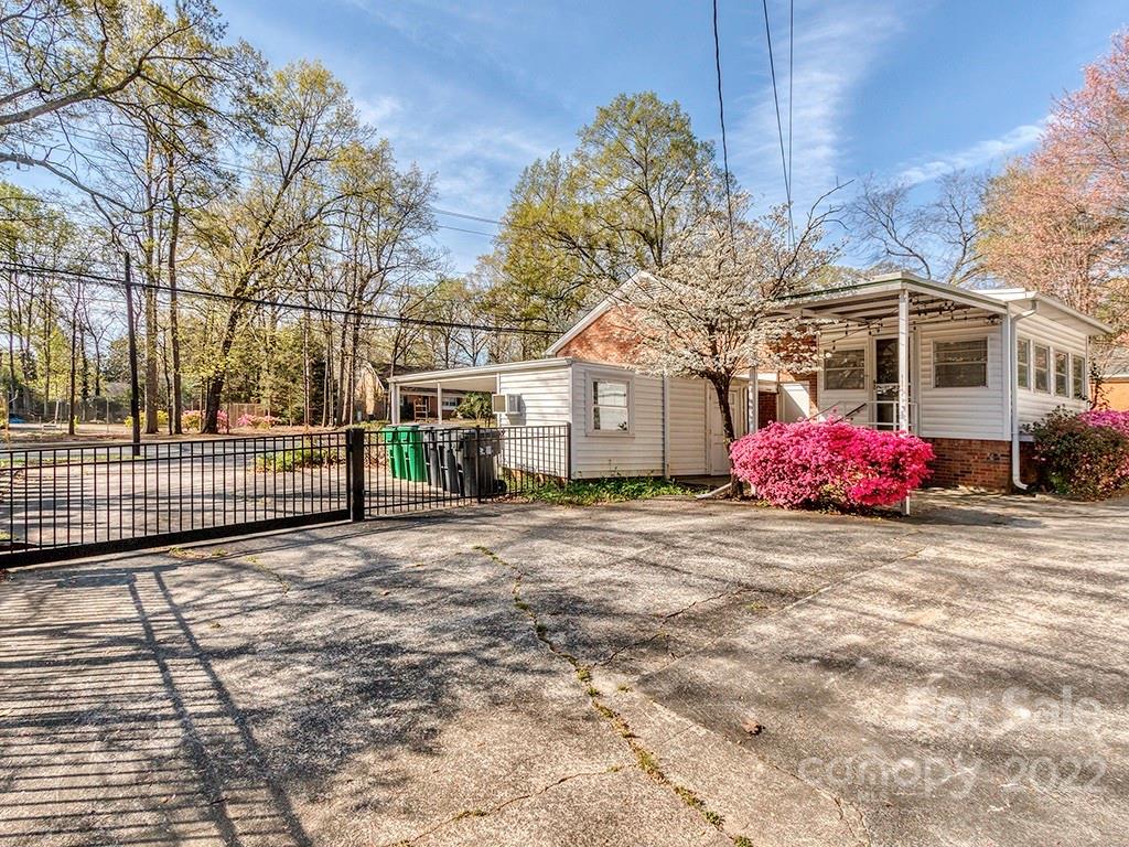 259 North Sharon Amity Road Charlotte, NC 28211 - Photo 25 of 27 a front view of a house with a yard