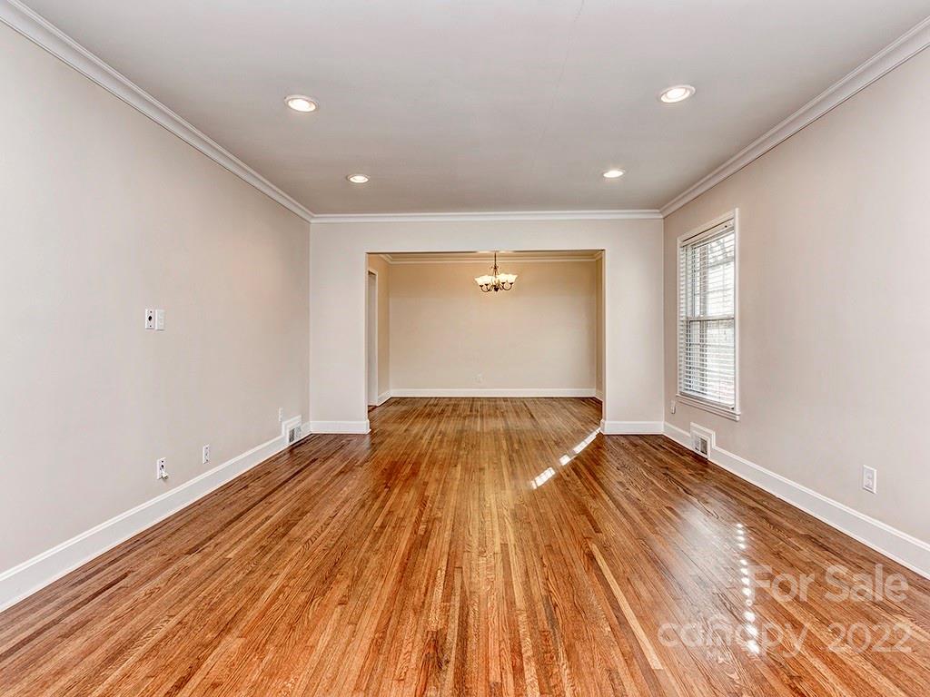 259 North Sharon Amity Road Charlotte, NC 28211 - Photo 5 of 27 a view of empty room with wooden floor and fan
