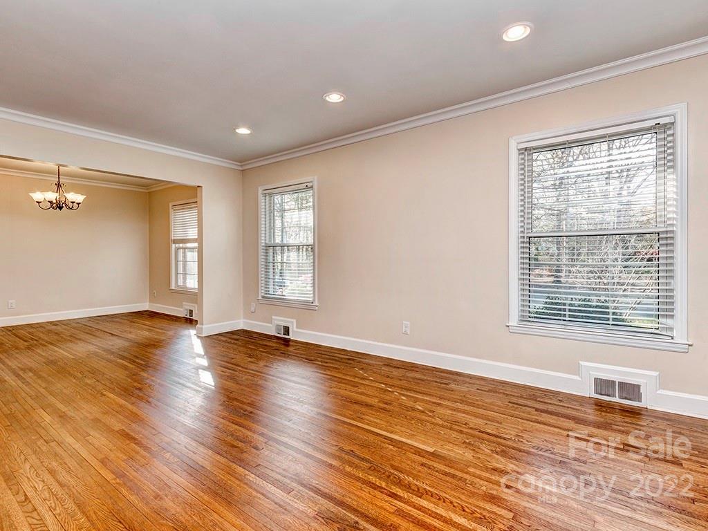 259 North Sharon Amity Road Charlotte, NC 28211 - Photo 6 of 27 a view of an empty room with wooden floor and a window