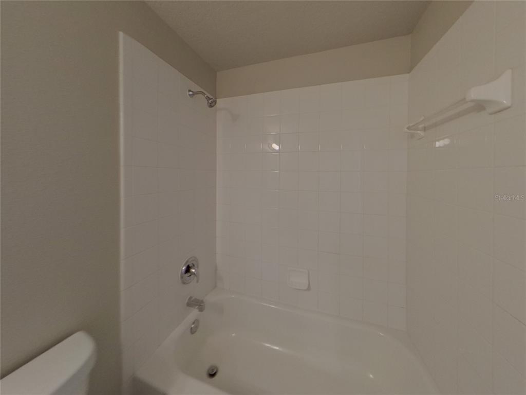 Undisclosed Address Riverview, FL 33579 - Photo 14 of 17 a bathroom with a bathtub