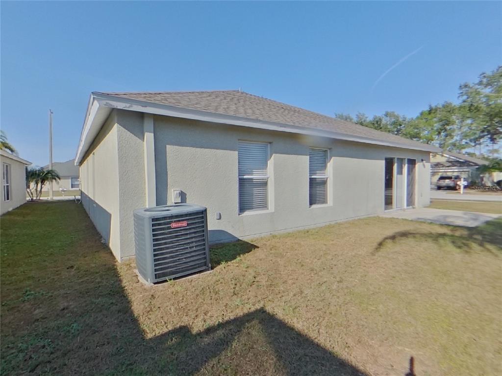 Undisclosed Address Riverview, FL 33579 - Photo 17 of 17 a view of a house with a yard
