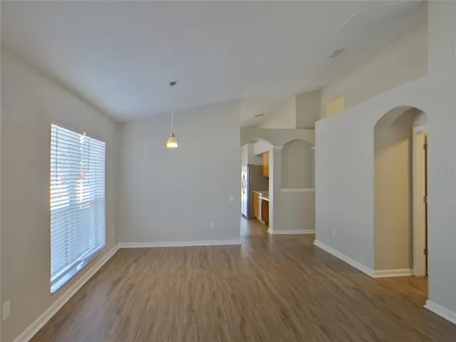 a kitchen with stainless steel appliances a refrigerator and a stove top oven