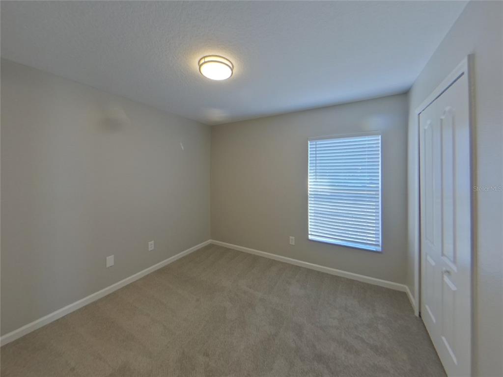Undisclosed Address Riverview, FL 33579 - Photo 10 of 17 an empty room with windows