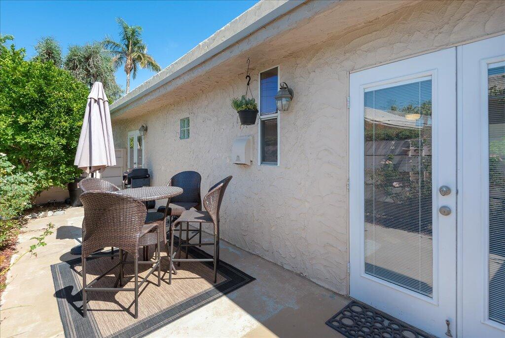 800 East Cottonwood Road, Unit 2 Palm Springs, CA 92262 - Photo 20 of 29 a view of a workspace with furniture and front door