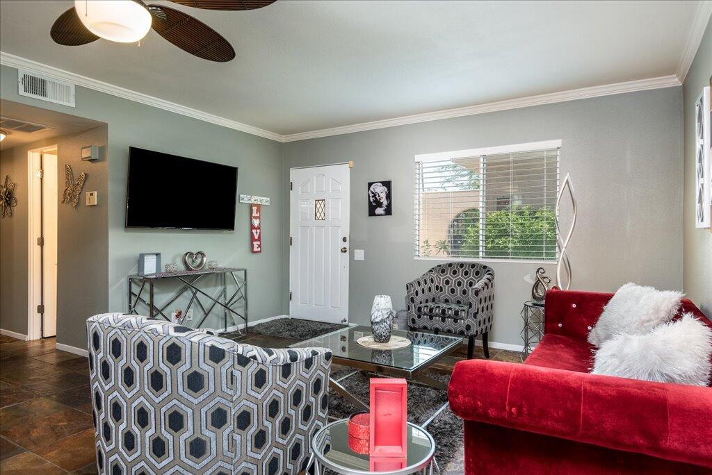 800 East Cottonwood Road, Unit 2 Palm Springs, CA 92262 - Photo 4 of 29 a living room with furniture and a flat screen tv
