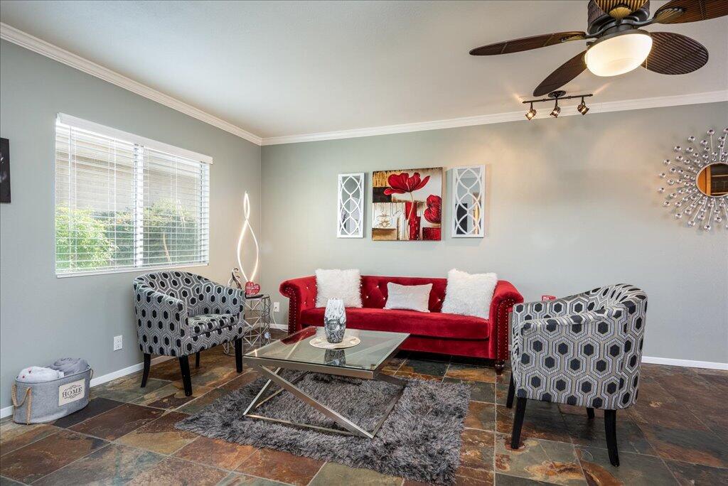 800 East Cottonwood Road, Unit 2 Palm Springs, CA 92262 - Photo 5 of 29 a living room with furniture and a window