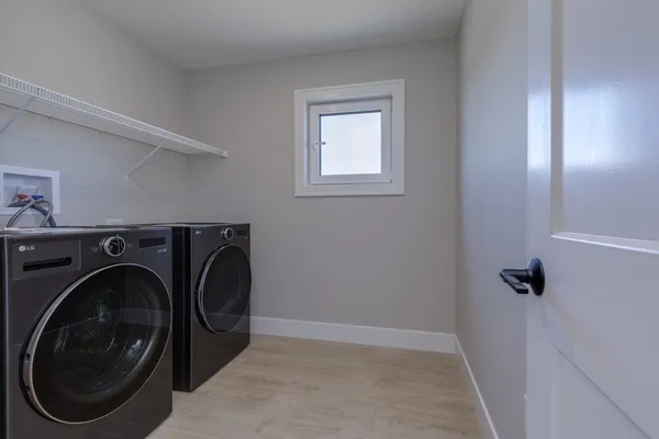 a utility room with dryer and washer