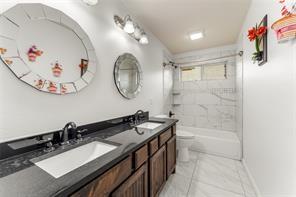 238 Rudder Road Gun Barrel City, TX 75156 - Photo 23 of 27 a bathroom with a sink a mirror and a bathtub