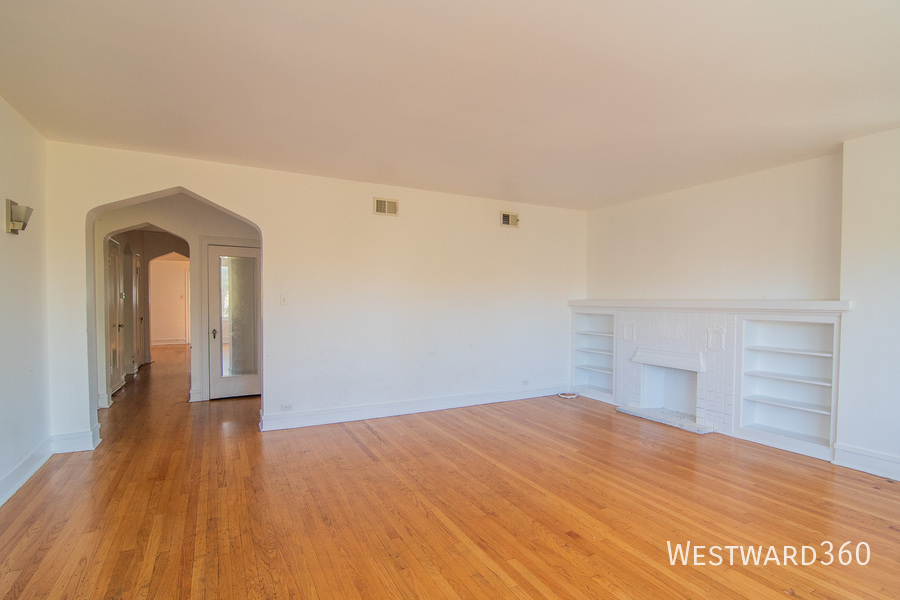 7833 South Kingston Avenue, Unit 2 Chicago, IL 60649 - Photo 6 of 15 a view of empty room with wooden floor