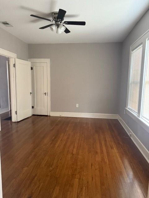2701 Stuart Drive Fort Worth, TX 76104 - Photo 4 of 9 wooden floor in an empty room with a window