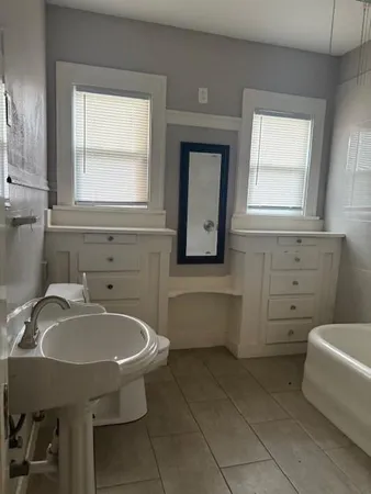 a bathroom with a sink and a bathtub