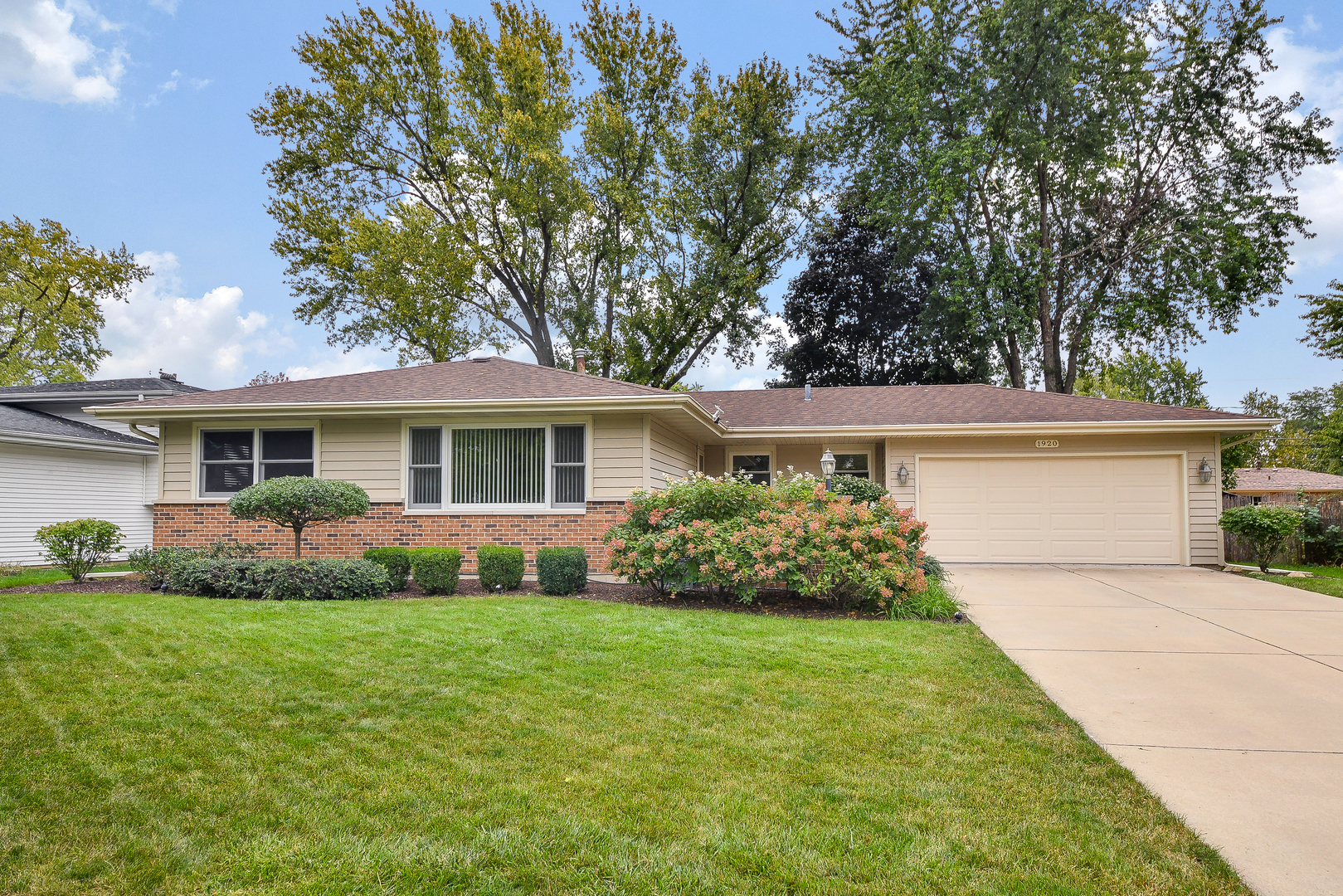 1920 Richard Street Aurora, IL 60506 - Photo 1 of 23 a front view of house with yard and green space