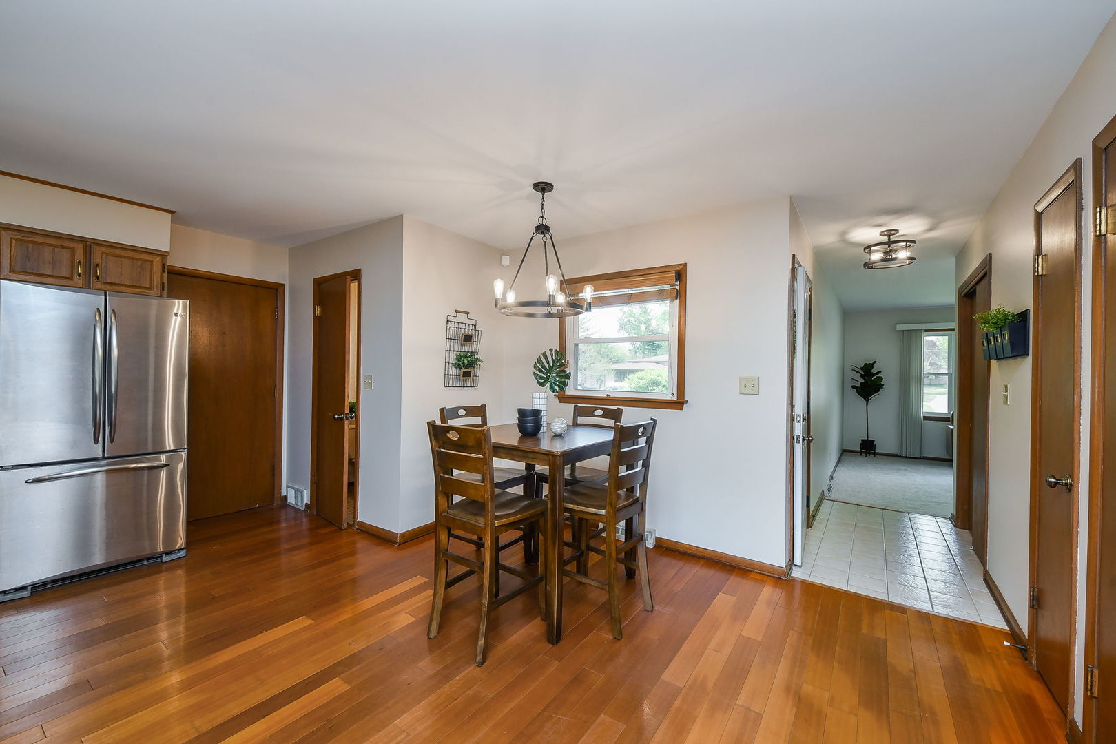 1920 Richard Street Aurora, IL 60506 - Photo 13 of 23 a view of a dining room with furniture window and wooden floor