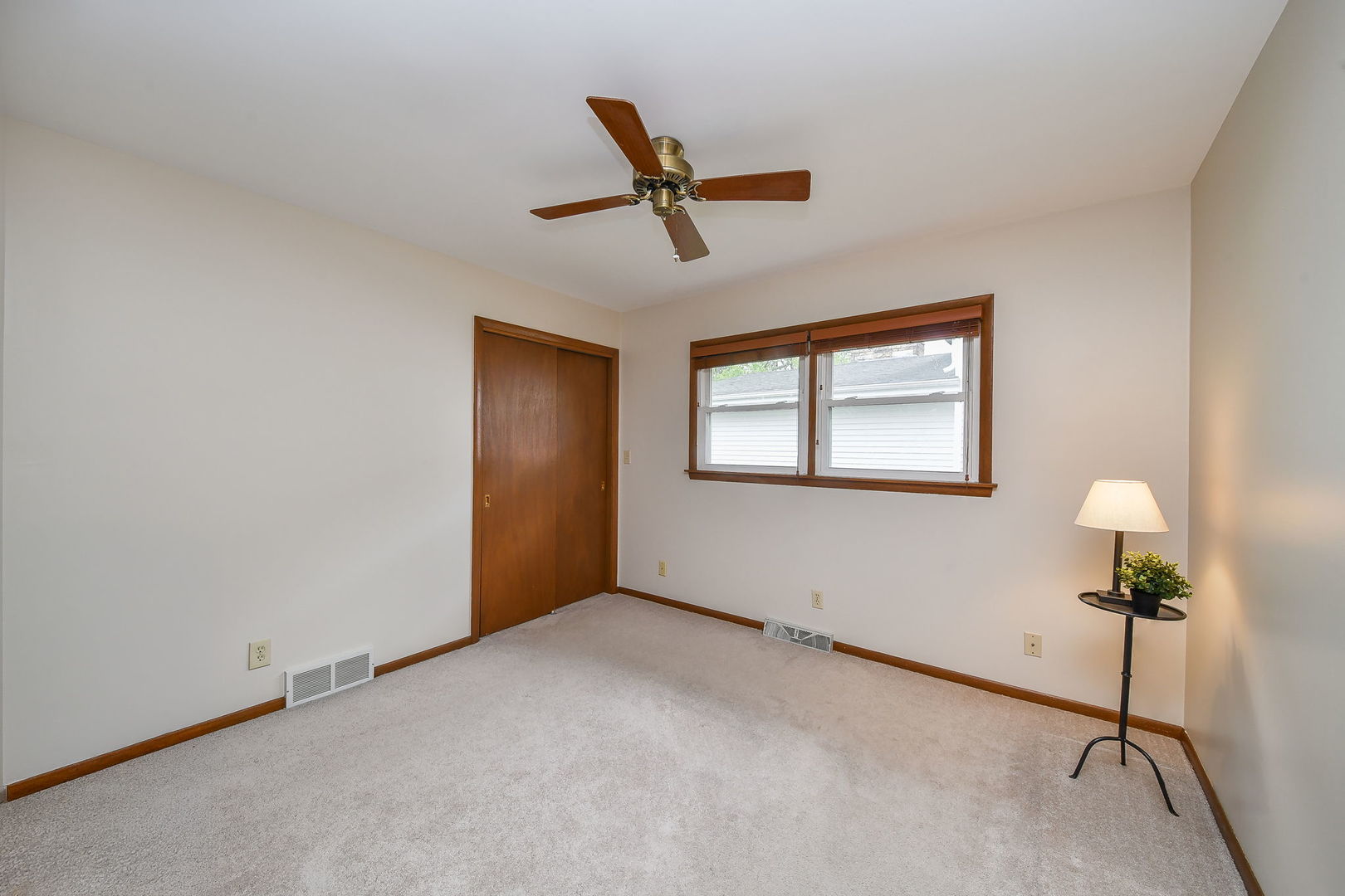 1920 Richard Street Aurora, IL 60506 - Photo 18 of 23 a view of a livingroom with a ceiling fan and window
