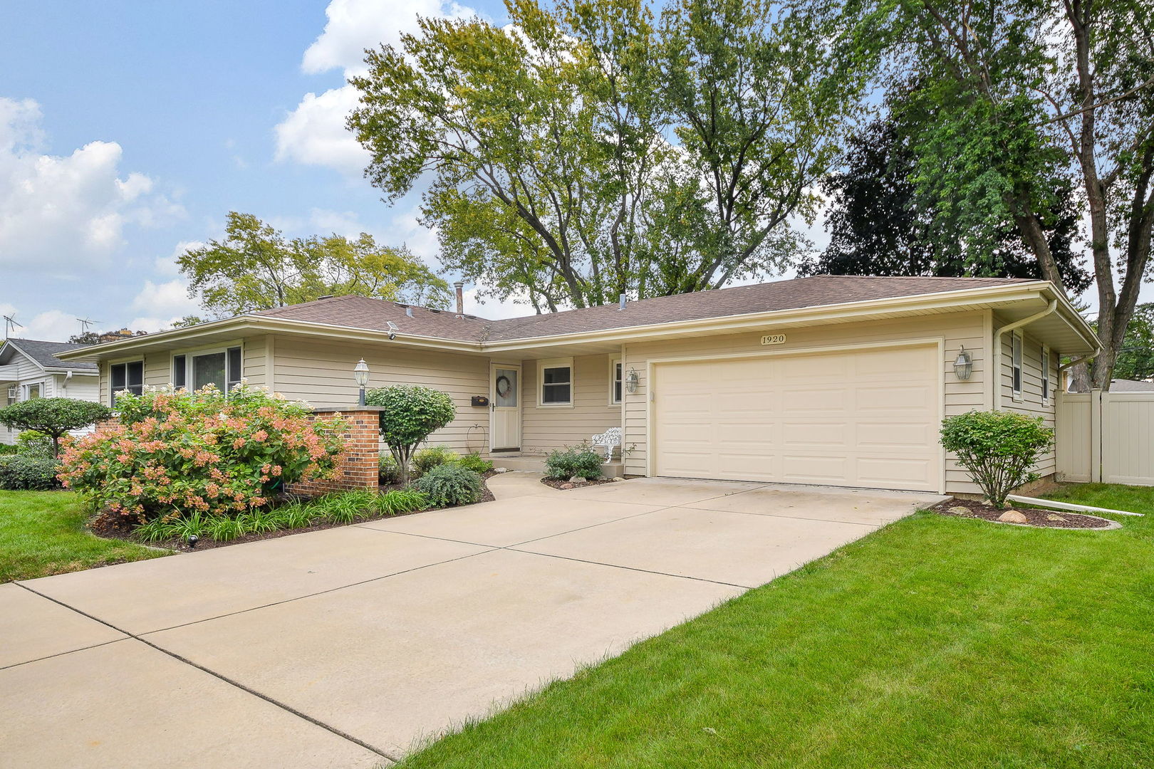 1920 Richard Street Aurora, IL 60506 - Photo 2 of 23 a front view of a house with garden