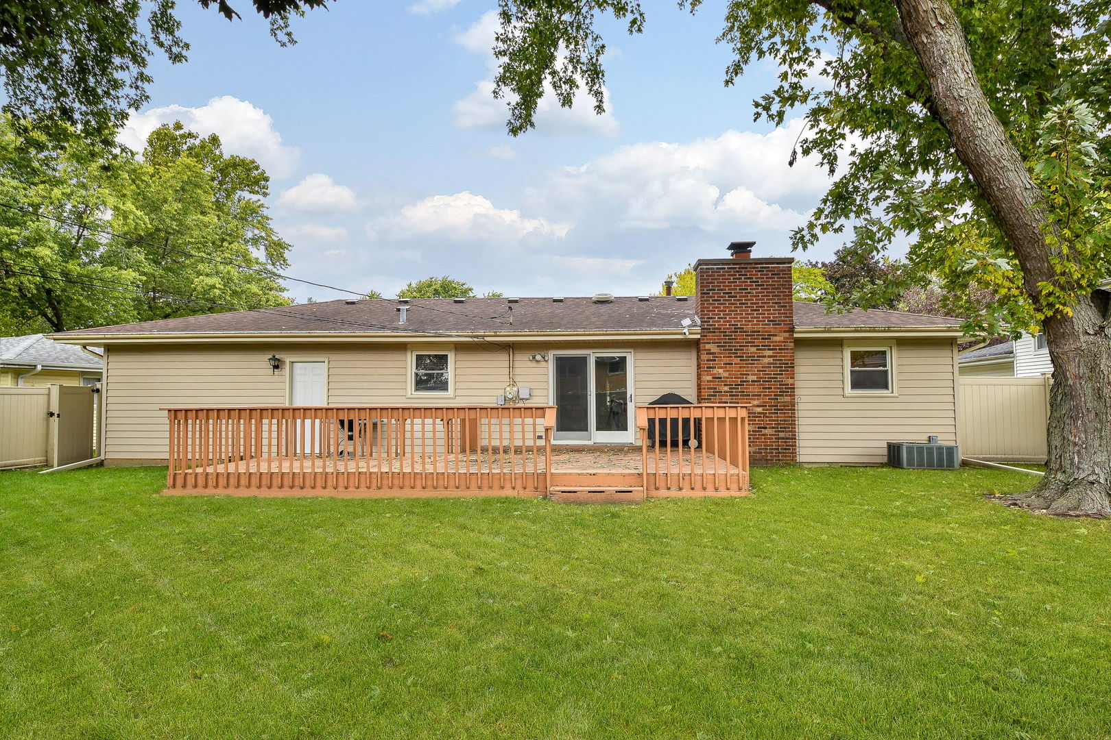 1920 Richard Street Aurora, IL 60506 - Photo 21 of 23 a view of a house with a yard and a patio