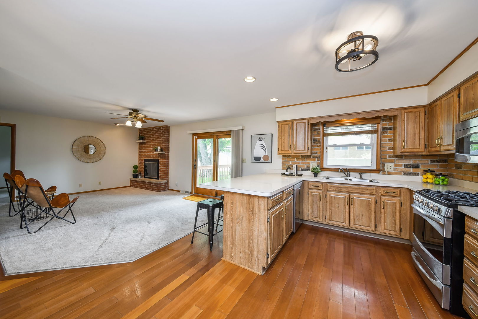 1920 Richard Street Aurora, IL 60506 - Photo 10 of 23 a kitchen with stainless steel appliances granite countertop a stove and cabinets