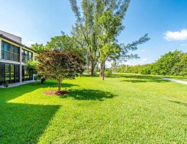 9284 Vista Del Lago, Unit 34F Boca Raton, FL 33428 - Photo 15 of 15 a view of a playground with a apartment