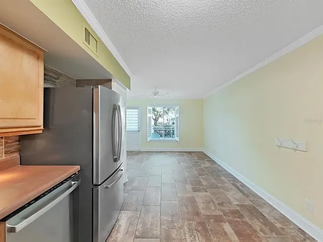 a view of a livingroom with a kitchen