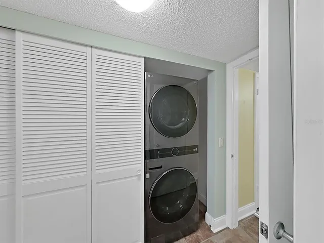 a bathroom with a granite countertop sink mirror and shower