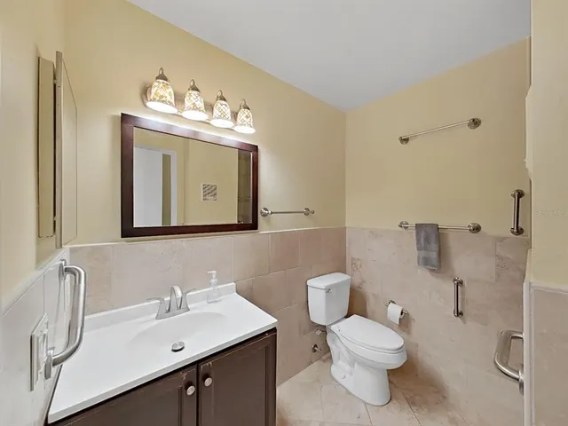 a view of a big room with windows and cabinet