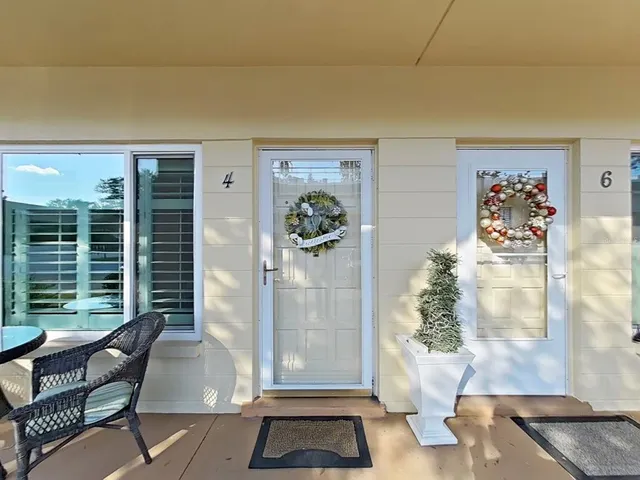 a view of a livingroom with furniture and front door