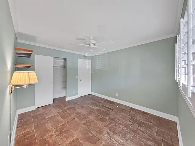 a view of a chairs and table in the balcony