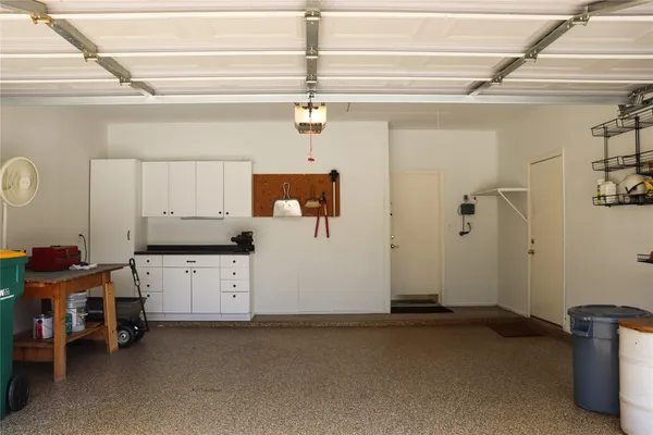 a view of a storage & utility room with a window