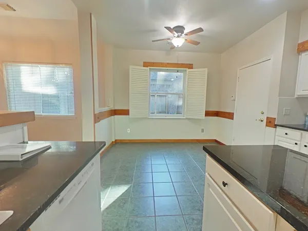a view of a kitchen with a sink and cabinet