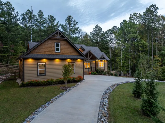 a view of houses with yard and mountain view in back