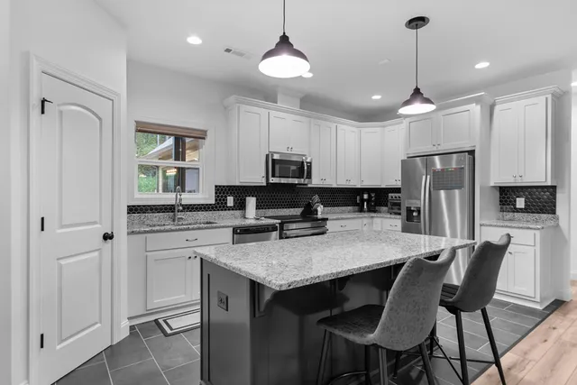 a bedroom with a bed and a table