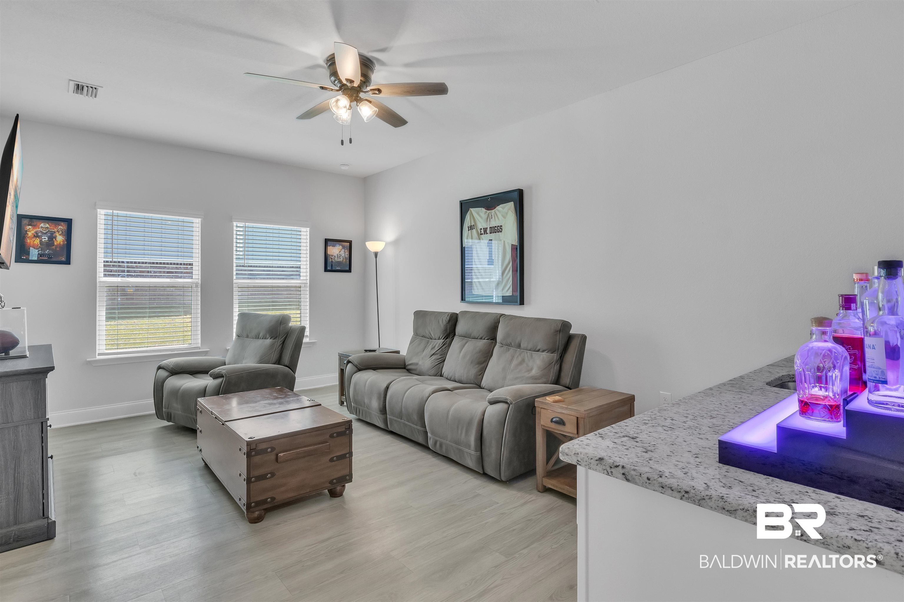 27862 Jade Court Daphne, AL 36526 - Photo 21 of 33 Living room with baseboards, a ceiling fan, visible vents, and light wood-style flooring