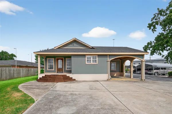 a front view of a house with yard